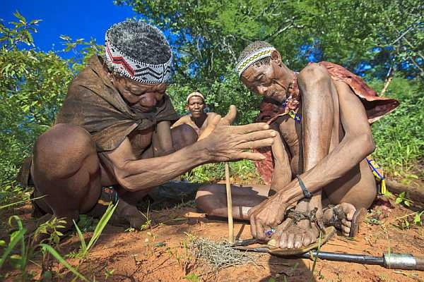 Bushmen making fire in Central Kalahari