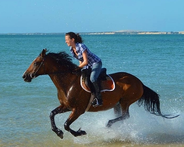 Azura Benguerra horse riding on the beach