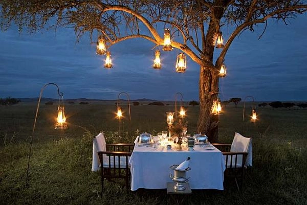Romantic honeymoon dinner on the Serengeti Plains at Singita Sabora Tented Camp